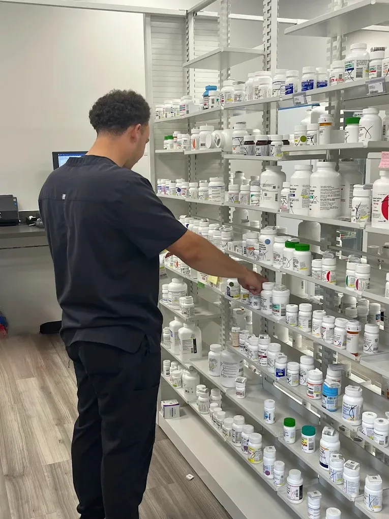 Pharmacist preparing prescriptions at Cannon's Discount Pharmacy